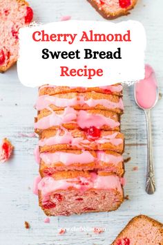 a loaf of cherry almond sweet bread with pink icing