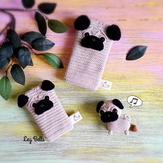 crocheted cell phone cases with black sheep on them