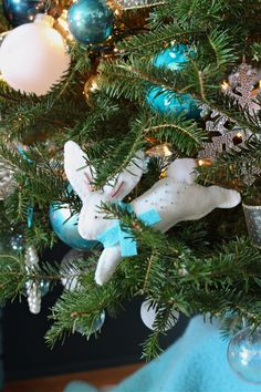 a close up of a christmas tree with ornaments