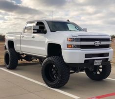 a white truck parked in a parking lot