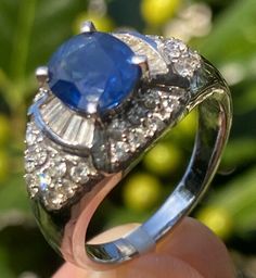 $3900 18K White Gold Blue Sapphire Diamond Vintage Dome Ring Certified Size 7.5 - can be re-sized up or down for an additional fee. No returns on altered items please Offered with a copy of the Gemological Appraisal Laboratory certificate with an estimated retail value of $3900 Weight 7.4 grams Diamonds: color G-H, clarity VS-SI, approximate total carat weight 1.00 ctw (estimated in the mounting)  Sapphire: approximate weight 1.50 carat, semi-transparent blue The face measures 11.5 mm North to South, the center is elevated approximately 6 mm  Stamped 18K Estate Diamond Jewelry, Dome Ring, Blue Sapphire Diamond, Domed Ring, Semi Transparent, Sapphire Diamond, Vintage Diamond, Ring Size 7, Blue Sapphire