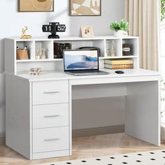 a white desk with drawers and a laptop on it