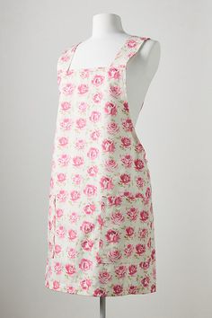 a dress on a mannequin with pink flowers