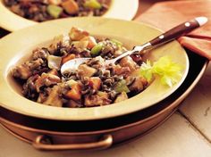 a yellow bowl filled with meat and vegetables