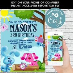 a person holding up a phone in front of a brick wall with an elephant birthday card