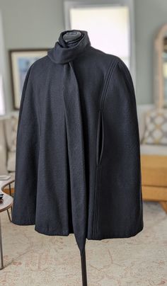 Black fleece cape. Nice and warm. This looks terrific with party clothes or casual wear. Two snap closures at the neck. Attached neck scarf. Arm slits. Works great for layering and not crushing your outfit! The black cape will fit a size small to medium. Measures 34" shoulder to hem. The brown cape will fit a medium to large. Measures 36" shoulder to hem Brown Cape, Costume Capes, Black Cape, Party Clothes, Cape Coat, Neck Scarf, Black Fleece, Neck Scarves, Mother's Day Gift