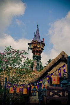 a tall tower with a clock on it's side