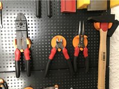 there are many tools hanging on the wall