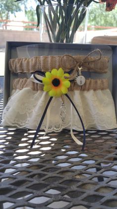 a yellow flower sitting on top of a table