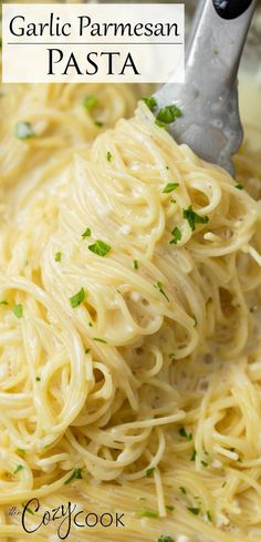 garlic parmesan pasta in a white bowl with a ladle full of it