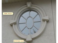 an image of a round window on the side of a building with arrows pointing in different directions