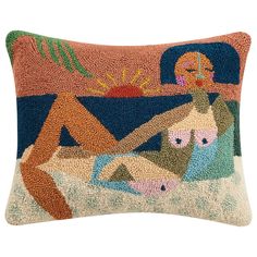 a decorative pillow with an image of a woman laying on the ground