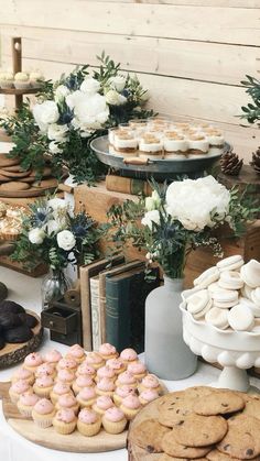 an assortment of desserts and pastries on a table