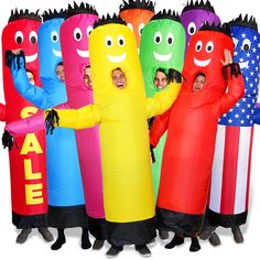 group of people in costumes standing next to each other