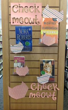 a bulletin board with some books on it