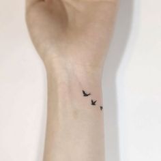 small birds tattoo on the wrist