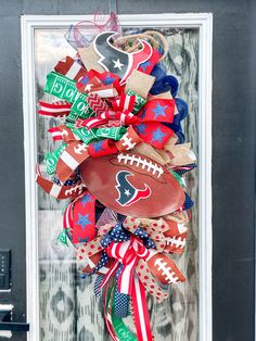 a football wreath is hanging on the front door