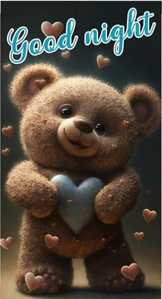 a teddy bear holding a heart with the words good night written in blue on it