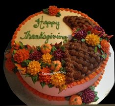 a thanksgiving cake decorated with flowers and leaves