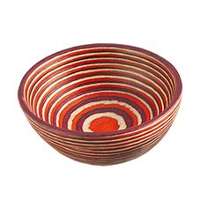 a red and white bowl sitting on top of a table