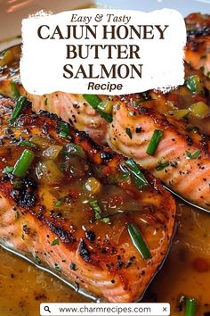 two salmon fillets with onions and green peppers on a white plate