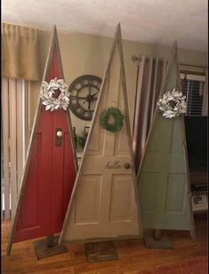 three christmas trees made out of old doors