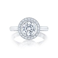 a diamond engagement ring with an halo setting