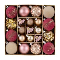 an open box filled with assorted christmas ornaments