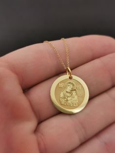 "14k Solid Gold 0.65 Inches Diameter Virgin Mary Necklace, Mother of God Pendant For Protection, Jesus Mother Necklace, Personalized Necklace 14K Solid Gold 16.5mm (0.65 Inch) Diameter Pendant ♥ Material of pendant and chain: Solid Gold 14K ♥ Packaging: All of our jewelry is beautifully boxed and ready for gifting For more personalized designs take a look here: ♥ www.etsy.com/listing/631444472 ♥ www.etsy.com/listing/645282627 ♥ www.etsy.com/listing/631455364 ♥ www.etsy.com/listing/645285037 ♥ ww Round Jewelry With Polished Finish For Mother's Day, Custom Yellow Gold Pendant Necklace For Mother's Day, Yellow Gold Custom Pendant Necklace For Mother's Day, Gold Necklace With Polished Finish For Mother's Day, Gold Polished Necklace For Mother's Day, Mother's Day Necklace With Polished Finish, Mother's Day Gold Polished Jewelry, Mother's Day Yellow Gold Medallion Necklace, Mother's Day Polished Gold Jewelry