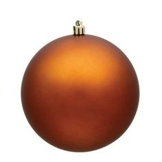 an orange christmas ornament on a white background