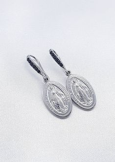 Miraculous medal earrings Sterling silver 925 Earrings length: 3.5 cm Silver Oval Single Earring, Hallmarked Sterling Silver Drop Plug Earrings, White Gold Pendant Earrings In Sterling Silver, White Gold Sterling Silver Pendant Earrings, Silver Sterling Silver Medallion Earrings, Silver Oval Earrings With Ear Wire, Silver Pendant Earrings Hallmarked, Silver Pendant Earrings For Anniversary, Traditional Silver Pendant Earrings