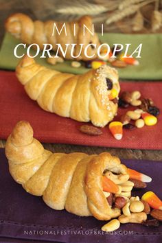 two croissants with corn and nuts in them on top of red place mats