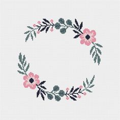 a cross stitch pattern with pink flowers and green leaves in the shape of a circle