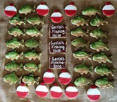 a table topped with lots of cookies covered in green and red frosted icing