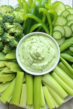 celery, broccoli, and cucumber arranged on a plate