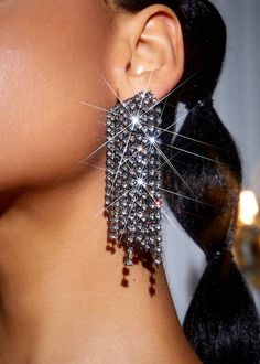 Experience elegance and glamour with our Zinc Alloy Rhinestone Tassel Earrings. Made with top-quality zinc alloy and adorned with sparkling rhinestones, these earrings are perfect for any special occasion or adding a touch of luxury to your everyday look. The tassel design adds a touch of movement and sophistication. Material: Zinc Alloy * Return and exchange are not supported Trendy Crystal Earrings For Evening, Trendy Evening Crystal Earrings, Elegant Silver Tassel Earrings For Evening, Glamorous Tassel Earrings For Wedding, Glamorous Silver Sparkling Crystal Earrings, Elegant Alloy Earrings With Rhinestones, Silver Crystal Earrings With Rhinestone Fringe, Trendy Alloy Earrings For Party, Trendy Alloy Party Earrings