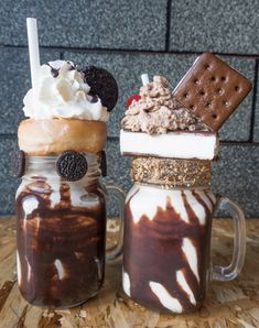 two mason jars filled with dessert and ice cream