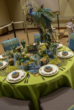 a table set up with plates and place settings