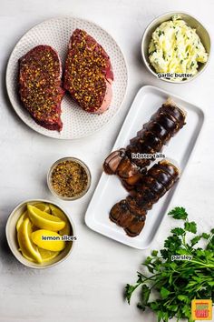 some meats and other food items on a white table