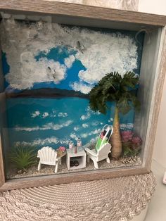 Beach scene. Love the palm tree setting.  Hang it set on a shelf. Measures approximately 12x12x3". Miniature Beach Scene, Shadow Box Kunst, Beach Shadow Boxes, Box Diorama, Shadow Box Art, Beach Scene, Shadow Boxes, Beach Scenes, The Palm