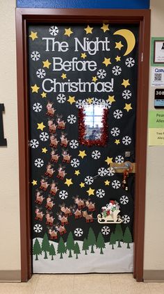 a door decorated with christmas decorations and santa's sleigh