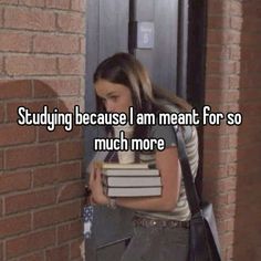 a girl leaning against a brick wall with books in her hand and text saying studying because i am meant for so much more