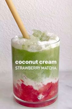 a glass filled with ice cream sitting on top of a table