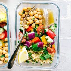 four plastic containers filled with different types of salads and vegetables, including chickpeas