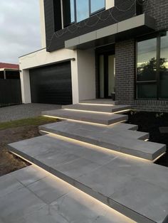 some steps that have been lit up in front of a house