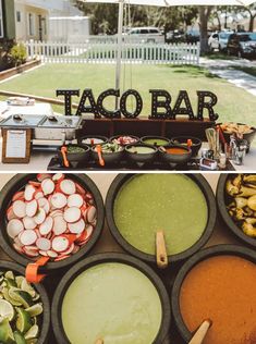 there are many different types of food on the table and behind it is a sign that says taco bar