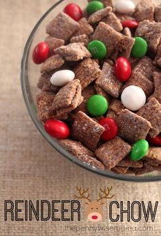 a glass bowl filled with reindeer chow and candy