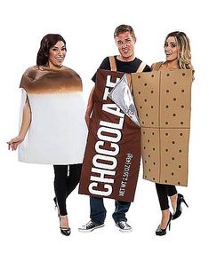 three people dressed up in costumes and holding chocolate bars on their shoulders, one is wearing a paper bag