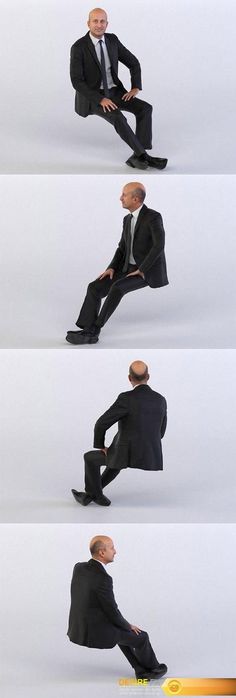 a man in a suit is sitting down