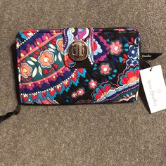 Never Used Vera Bradley Turnlock Floral Print Wallet. Measures 8 X 5 Inches. Multiple Pockets Inside For Cards And Zipper Pocket On The Back. Pretty Black, Purple Orange And Green. Versatile Multicolor Travel Wallets, Multicolor Bifold Bags For Everyday Use, Casual Multicolor Coin Purse For Travel, Multicolor Bifold Travel Bag, Multicolor Travel Wallet Clutch, Multicolor Clutch Wallet For Travel, Casual Multicolor Wallet With Cell Phone Pocket, Casual Multicolor Wallets For Daily Use, Trendy Multicolor Clutch Wallet